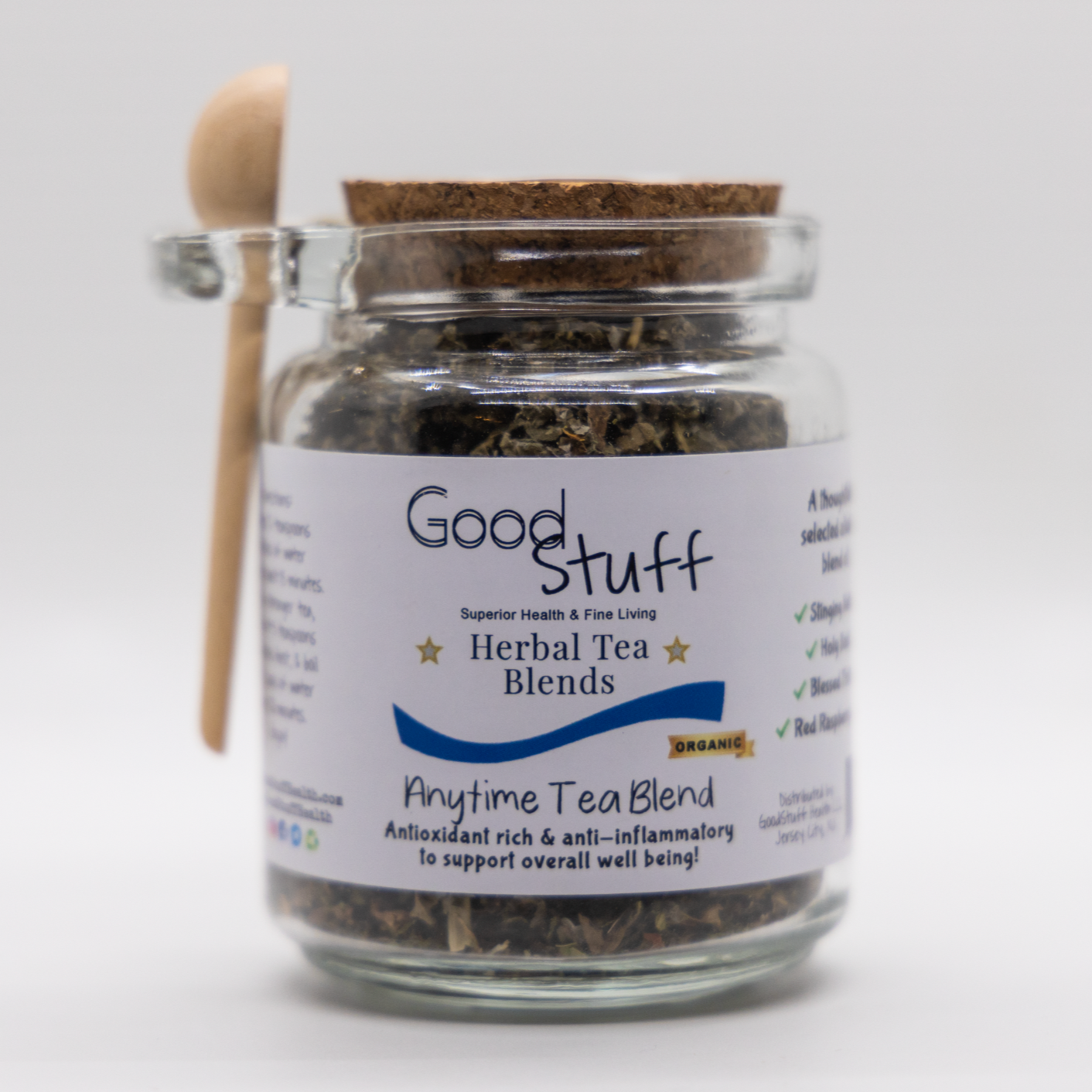 Glass jar including a wooden spoon full of an anytime herbal blend made from Red Raspbery Leaf, Holy Basil, Stinging Nettle, and Blessed thistle. All alkaline, organic, electric, and vegan.