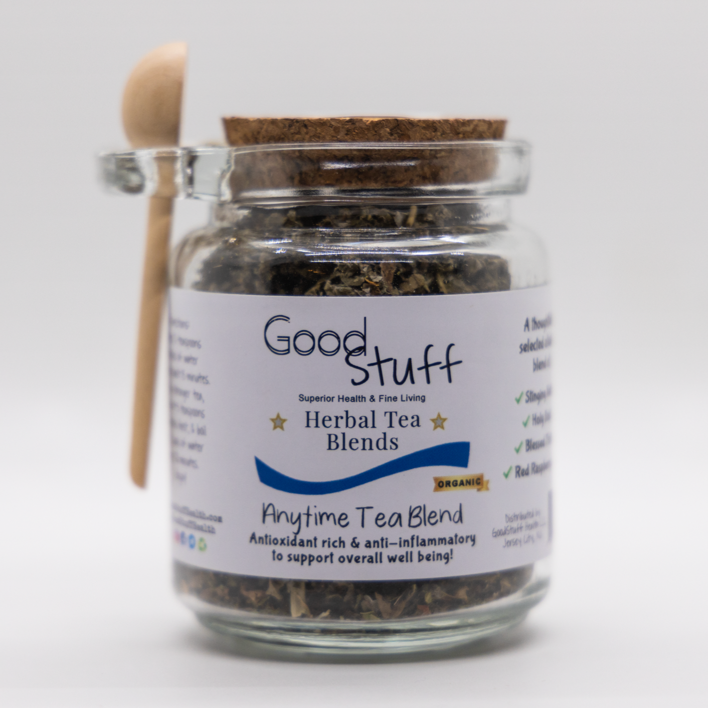 Glass jar including a wooden spoon full of an anytime herbal blend made from Red Raspbery Leaf, Holy Basil, Stinging Nettle, and Blessed thistle. All alkaline, organic, electric, and vegan. 