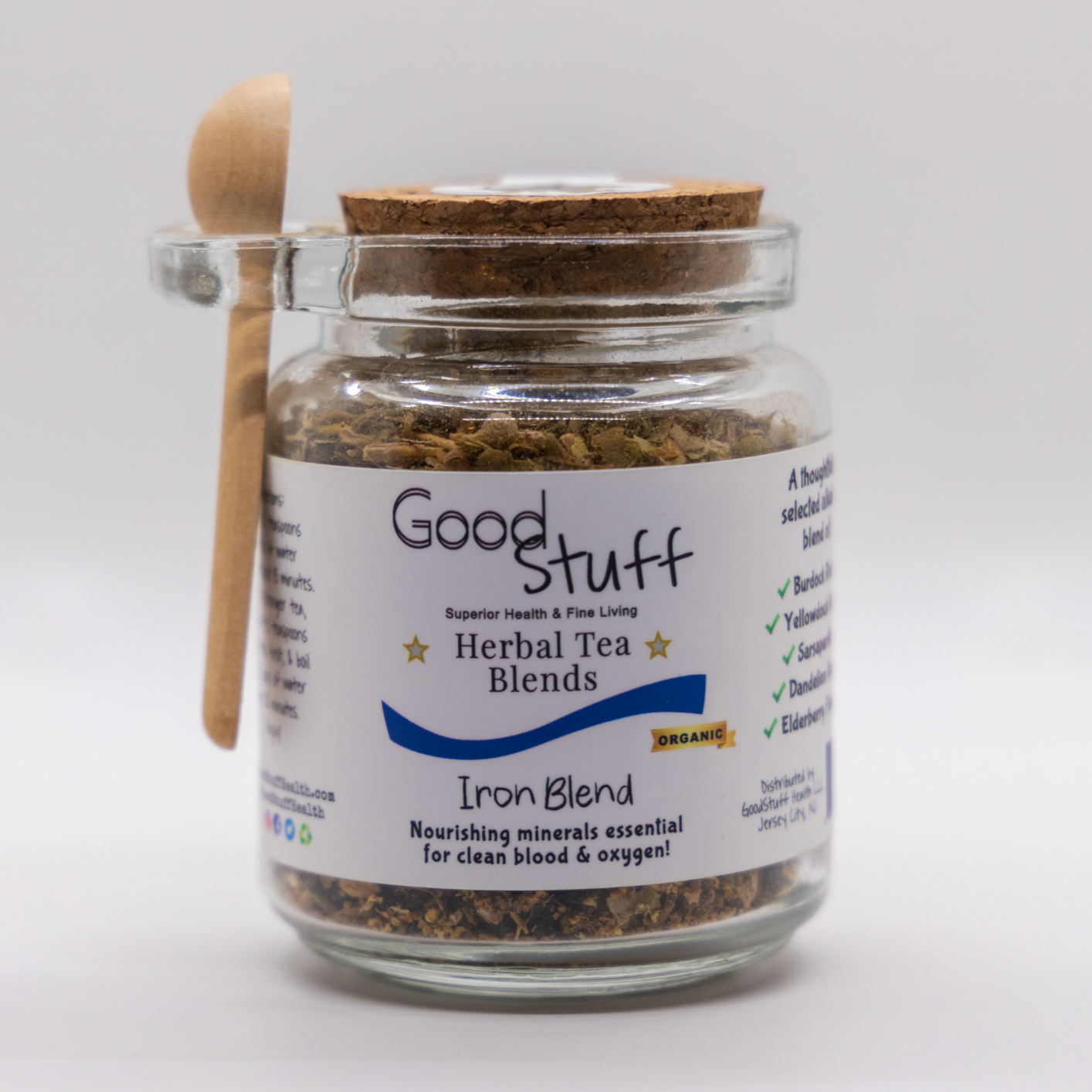 Glass jar including a wooden spoon full of an iron dense herbal blend made from Burdock Root, Yellowdock Root, Sarsaparilla, Dandelion Root, Elder Flower, and Elderberries. All alkaline, electric, organic, and vegan.