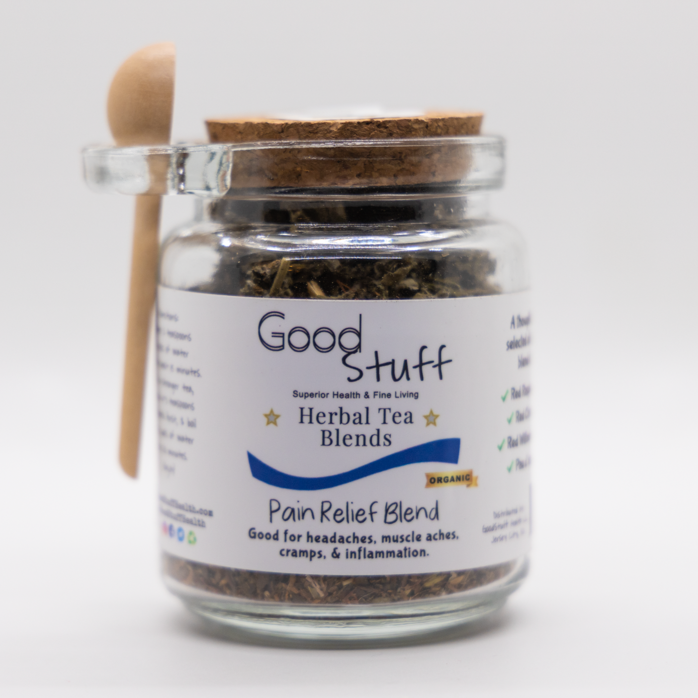 Glass jar including a wooden spoon full of a pain relief herbal blend made from Red Raspberry Leaf, Pau d'arco, Red Willow Bark, and Red Clover. All alkaline, organic, electric, and vegan. 